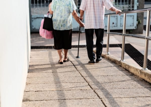 low-section-people-walking-footpath